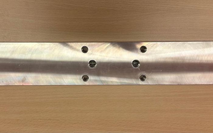 A newly machined Acto distribution bar manufactured by WCS