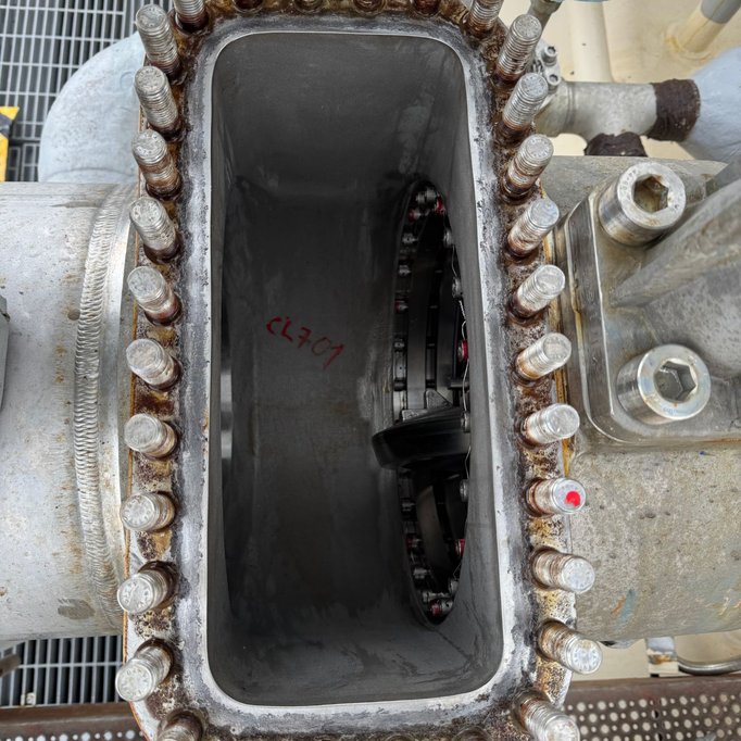 Open cryogenic butterfly valve body seen from above, with the disc and seal ring visible inside